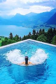 This Heated Rooftop Pool In Switzerland Is Everything We Could Ever Dream Of Road Trip Playlist Trip Travel