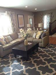 In this featured living room, beige and gray decor do the heavy lifting while dark brown metal end tables add a striking contrast. Pin By Ruth Rivera On Before And Afters Tan Living Room Home Living Room Brown Living Room