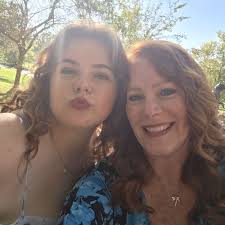 For those that have used the over the table rod with flowers, fairy lights  and photos. How have you kept the fairy lights from sliding down the pole?  I understand some sag