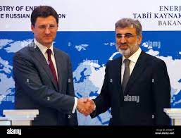 Turkey's Energy Minister Taner Yildiz (R) shakes hands with his Russian  counterpart Alexander Novak following a news conference in Istanbul  December 2, 2012. Russia would be willing to increase its gas supplies