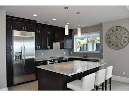 Gray Tile Plank Floors With Espresso Cabinets Long Handle Fixtures Gray Countertops Paint Is Idea Too Espresso Cabinets Kitchen Remodel Grey Countertops