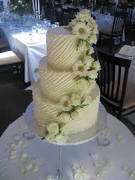 White Chocolate Ganache Wedding Cake With Barberon Daises White Roses Spanish Texture Chocolate Ganache Cake Chocolate Wedding Cake Ganache Cake