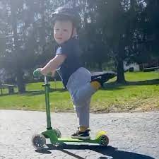 Your boy little scooter stock images are ready. Viral Video Of Little Boy Scootering With His Leg Up Popsugar Family