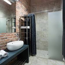 Concrete often already exists as a subfloor underneath surface coverings and can be relatively inexpensive to dress up with a variety of polishes, stains, and other decorative treatments. Industrial Bathroom Ideas That Are Ultra Chic