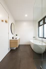 Clean workshop for photography or presentation. Ensuite With Charcoal Floor Tiles And White Wall Tiles Freestanding Bath Floor Tiles Design Modern Bathroom Black Floor Tiles
