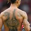 Memphis depay channelled his inner tiger king as he posed with a liger and showed off a big cat tatt on his entire back. 1