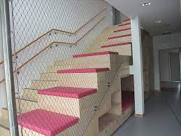 Cable railing can use both metal and wood posts. Stair Railing Made Of Stainless Steel Rope And Mesh