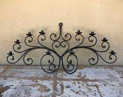 Eclipse over jalisco, handcrafted sun and moon steel wall sconce from mexico. Iron Candelabra Etsy Rustic Wall Candle Holders Wrought Iron Candle Holders Wall Candle Holders