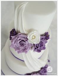 Purple 3 Tier Wedding Cake With Gumpaste Flowers And Drape Cakes By Lynz