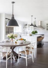 Check out our tips to buy a kitchen table. Round Gray Trestle Dining Table With White Wishbone Chairs Transitional Kitchen