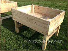 Flip the planter box over and repeat these steps on the opposite side with the remaining two wood legs. Elevated Garden Beds On Legs Plans Building Raised Garden Beds Diy Raised Garden Building A Raised Garden