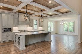 Beautiful Kitchen With Grey Cabinetry And Island Love The Coffered Ceilings And The Lantern Light Fixtures Over The Island Wit Home Kitchen Ceiling New Homes