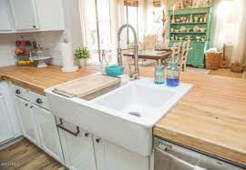 Black walls and a matching island instantly makes the oak butcher block counters in this kitchen appear fresh and modern. Butcher Block Countertops The Pros And Cons Bob Vila