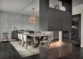 Gray alijah 5 piece extendable pub table set. Gray Modern Dining Room With Stone Fire Table Large Hanging Cabinet And Decorative Chandelier Hgtv