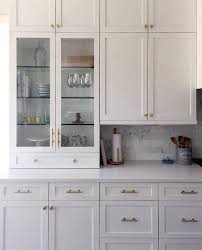 White shaker kitchen cabinet with black hardware pull white quartz countertop and grey backsplash tiles. Top 70 Best Kitchen Cabinet Hardware Ideas Knob And Pull Designs