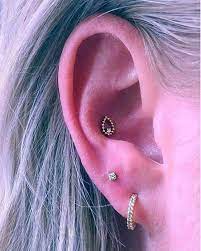 Bvla Sophie S Tear And Stud Ear Curation By Odd Angle Via Time Bomb Tattoo On Instagram Earring Earcuration Earrin Ear Lobe Piercings Ear White Sapphire