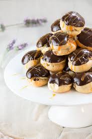 Double Chocolate And Caramel Profiteroles Crisp Choux Pastry Filled With Milk Chocolate Mousse An Profiteroles Recipe Dessert Recipes Easy Chocolate Desserts