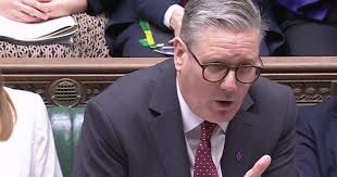 What are the pink and purple badges MPs are wearing at PMQs?