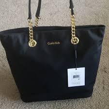 Amber gold is, as its name suggests, centered around the note of amber, a resinous incense type of dry down taking over most of the fragrance after. Calvin Klein Bags Calvin Klein Gold Chain Tote Poshmark
