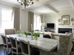 This round dining table features an intricate trestle base, a great update to a classic table. Distressed Dining Table Transitional Dining Room Christina Murphy Interiors