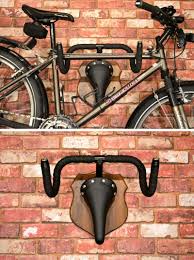 Made From Recycled Bike Parts This Modern Creative Rack Is Meant To Mimic Hunting Trophies However Wall Mount Bike Rack Bike Storage Solutions Diy Bike Rack