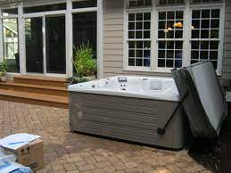 Maybe you would like to learn more about one of these? Pin By Galerie Virivek Wellness Fi On Hot Tub Installations Custom Stone Fireplace Spa Landscaping Patio Design