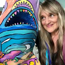 Me and my buddy, Sam the Shark... here's a glimpse of the side that has not  been painted...I will be painting him at the Hub