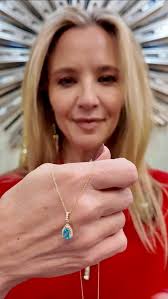 ✨ Radiance in Every Hue ✨ This one-of-a-kind pendant is pure magic —  featuring a mesmerizing 25.26ct opal that glows from within, framed by  2.88ct of multi-colored sapphires and kissed with diamond