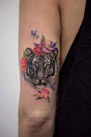 12 Best Tiger And Flower Tattoo Designs Tiger Tattoo Small Elbow Tattoos Animal Tattoos