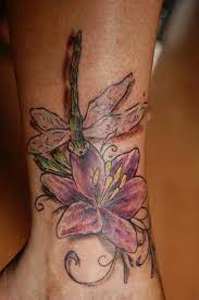 Across the ages, the lotus flower has stood for different things across different cultures, including: Dragonfly And Lily Tattoo On Ankle