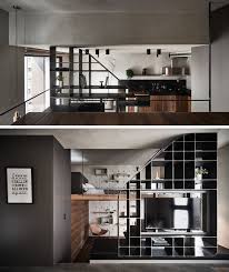 Clean and modern apartment interior design makes a creative use of available space to make an apartment look stylish. The Stairs In This Small Apartment Lead Up To A Loft Bedroom
