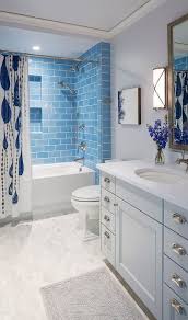 Discover how to create a beautiful blue bathroom, no matter your style. Traditional Coastal Home With Classic White And Blue Bathroom Budget Bathroom Remodel Modern Small Bathrooms Small Bathroom Remodel