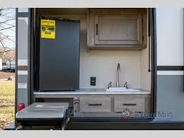Super clean kitchen which includes, oven, stove, mircrowave, fridge, double sink, and counter space to prep your meal. Coachmen Apex Travel Trailer Review 3 Light Trailers For Easy Travel Rv Value Mart Blog