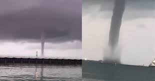 A man on another ship captures the scary moment a large waterspout passes over a ship. 0xeudofxyq20gm
