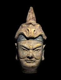 A Polychrome Stucco Head of a Temple Guardian Lot 333
