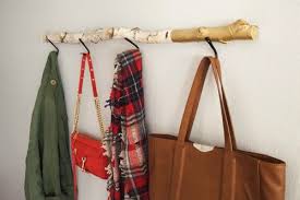 Build a diy coat rack out of a newel post! 8 Creative Diy Coat Hangers For Your Entryway Shelterness