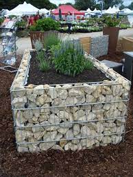 The gabion basket offers an easy way to build a strong retaining wall wherever you need to keep out the wind, precipitation, etc. Gabion Raised Garden Bed Diy Raised Garden Building A Raised Garden Raised Garden