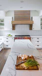 Install glass tile with a light shade of grey for a desired glowing look for your kitchen backsplash. Gray Travertine Backsplash Photo Jobsatbournemouth Com