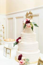 Four Tier White Wedding Cake Maroon And Light Pink Flowers Gold Customized Cake Topper Vanilla R Wedding Cakes Maroon Pink Wedding Cake Gold Wedding Cake