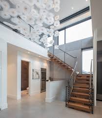Stairs leadng to basement with wainscot trim идея дизайна: 75 Beautiful Contemporary Staircase Pictures Ideas March 2021 Houzz