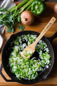 The holy trinity of cajun cooking typically uses a 1:1:1 ratio of bell peppers to onions to celery. The Cajun Holy Trinity National Onion Association