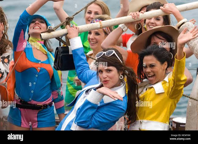 PIRATE RADIO, (aka THE BOAT THAT ROCKED), Gemma Arterton (center of frame),  2009. Ph: Alex Bailey/©Focus Features/courtesy Stock Photo - Alamy