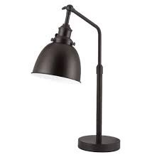 With adjustable focus, this black and brass task lamp is the perfect desk companion whether completing a homework assignment or perusing the newspaper. Vintage Desk Lamp Design Desk Lamp Design Desk Lamp Lamp