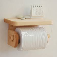 This rustic toilet paper holder has a simple design, made of recycled wooden panels. Wooden Toilet Paper Holder Wall Mount With Shelf