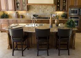 A white tile backsplash provides contrast to the blue cabinet color. Kitchen Island Table Height Kitchen