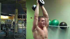 Keep your upper arms in place and hinge your elbow, lifting the dumbbells overhead through a full range of motion. How To Standing Overhead Dumbbell Tricep Extension Youtube