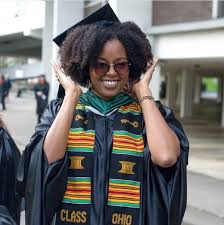 Then create a loose twisted bun in the back and add hair in from the top and front. Top Ways To Slay In Your Graduation Cap With Natural Hair Essence
