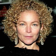 Try adding some teased curls to the upper layer of your if you're a woman over 50 with naturally wavy hair, this look is for you! Best Curly Hairstyles For Women Over 50