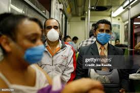 Priest Rogelio Peralta Gomez delivers communion to a young girl who... News  Photo