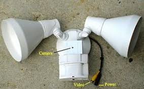 Some motion detector lights work based on temperature. Outdoor Motion Detector Spot Light With Hidden Covert Color Camera Ebay